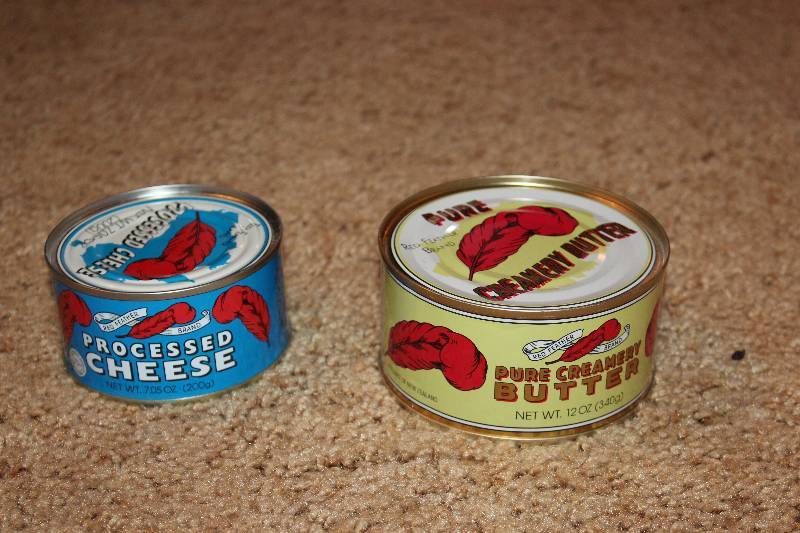 lot 42 image: Red Feather 12oz. Can Pure Creamery Butter, Processed Cheese