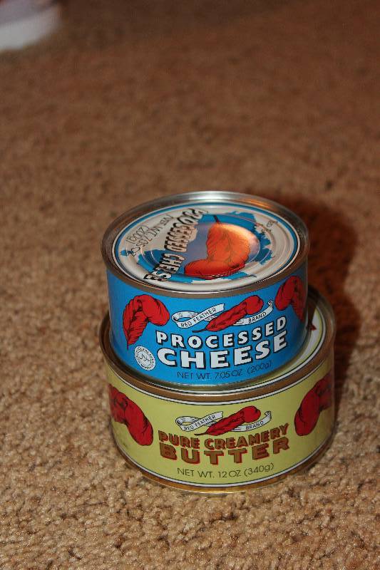 lot 43 image: Red Feather 12oz. Can Pure Creamery Butter, Processed Cheese