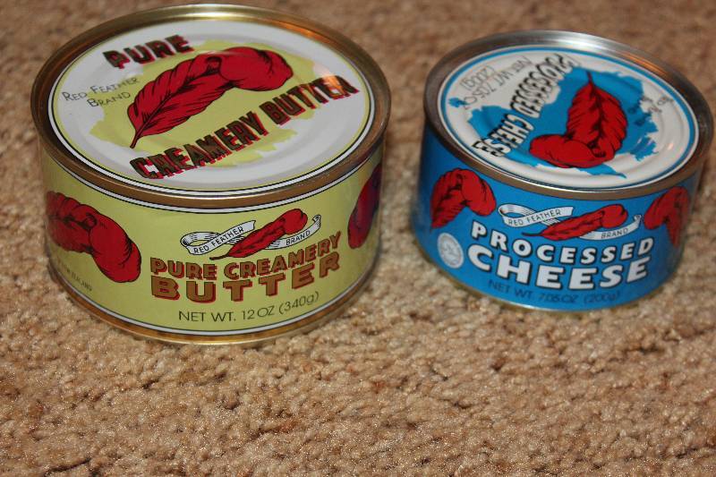 lot 44 image: Red Feather 12oz. Can Pure Creamery Butter, Processed Cheese