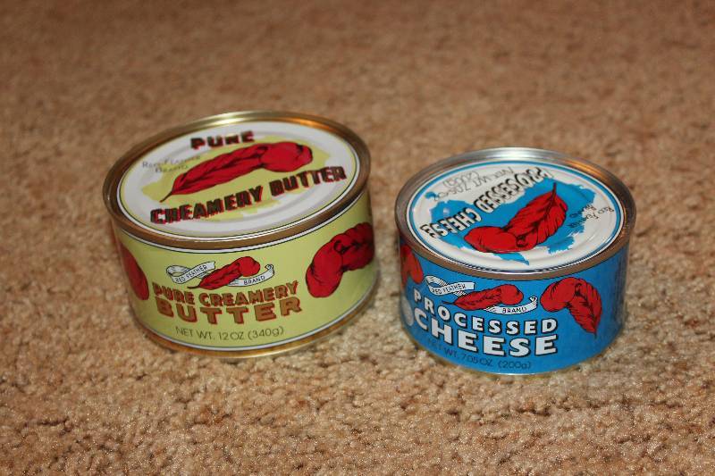 lot 46 image: Red Feather 12oz. Can Pure Creamery Butter, Processed Cheese