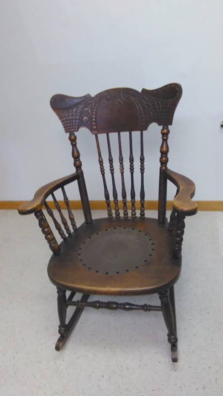 lot 10 image: Wood Rocking chair with Medallion center.