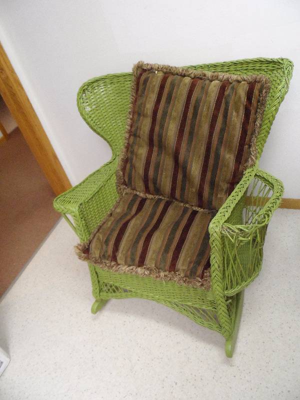 lot 24 image: Antique wicker rocker.