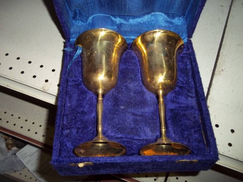 lot 38 image: Set of 2 solid brass wine goblets.  These are nice quality,  about 7.5 high, comes with case.
