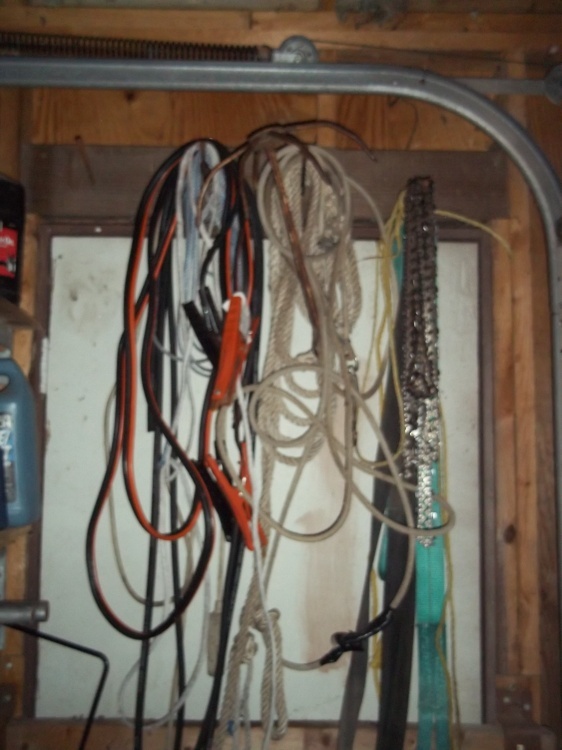 lot 63 image: Lot of jumper cables, chain saw chains, rope, etc