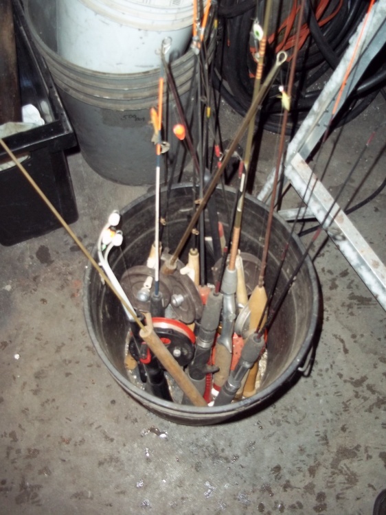 lot 104 image: Bucket with ice fishing rods