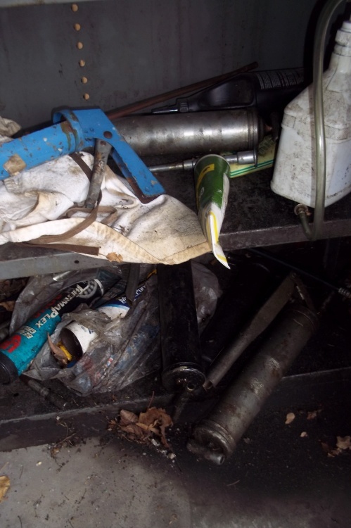 lot 176 image: Contents of bottom 2 shelves includes grease guns, grease, landscaping spikes