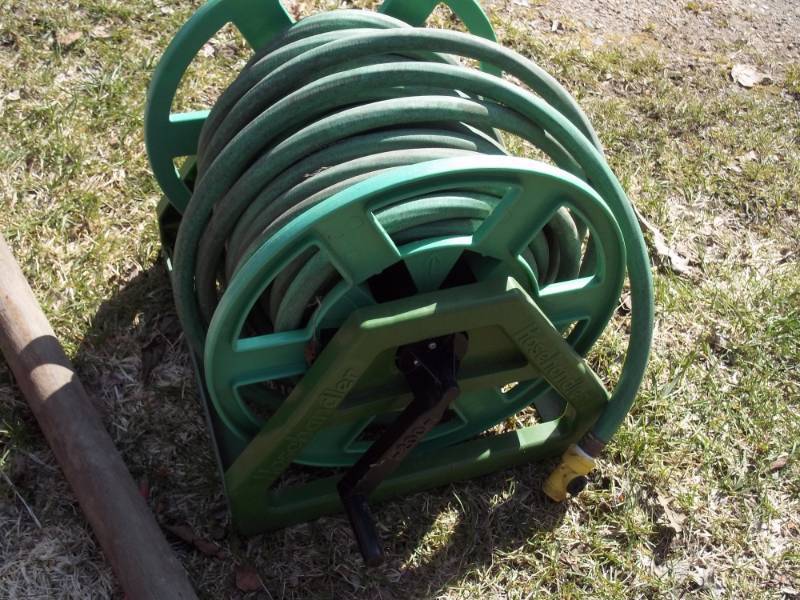 lot 312 image: Garden hose with reel