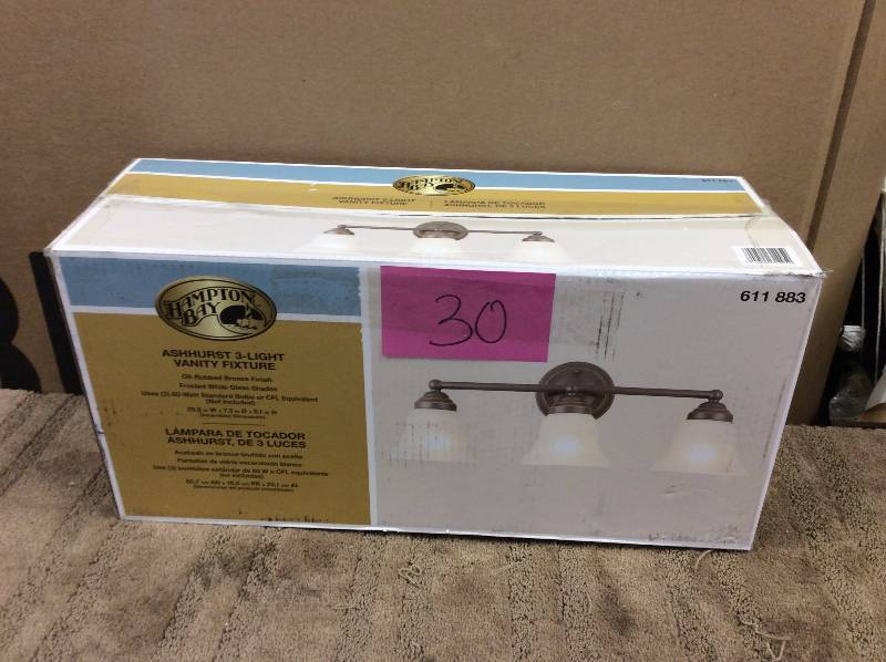 lot 30 image: Hampton Bay 3-Light Oil Rubbed Bronze Vanity Light, Model#  EGM1393A-4ORB  open box never used