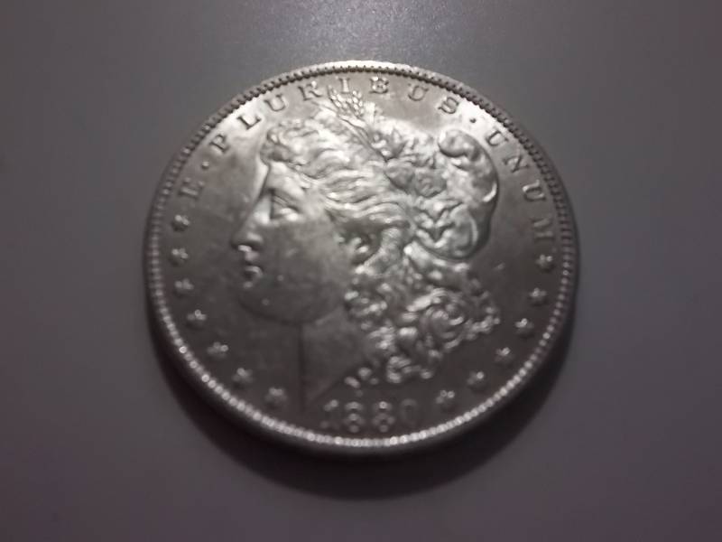 1880 O  Morgan Silver Dollar Very High Grade MS (In MS60 Valued  $110.00)