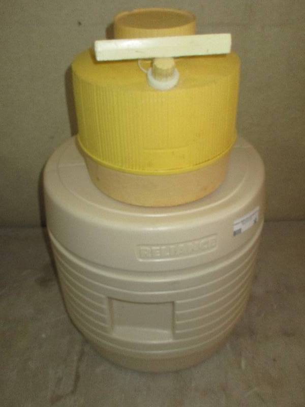 lot 32 image: camping toilet by reliance and water jug