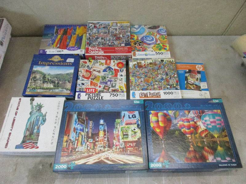 lot 64 image: 9 puzzles and hp photo paper