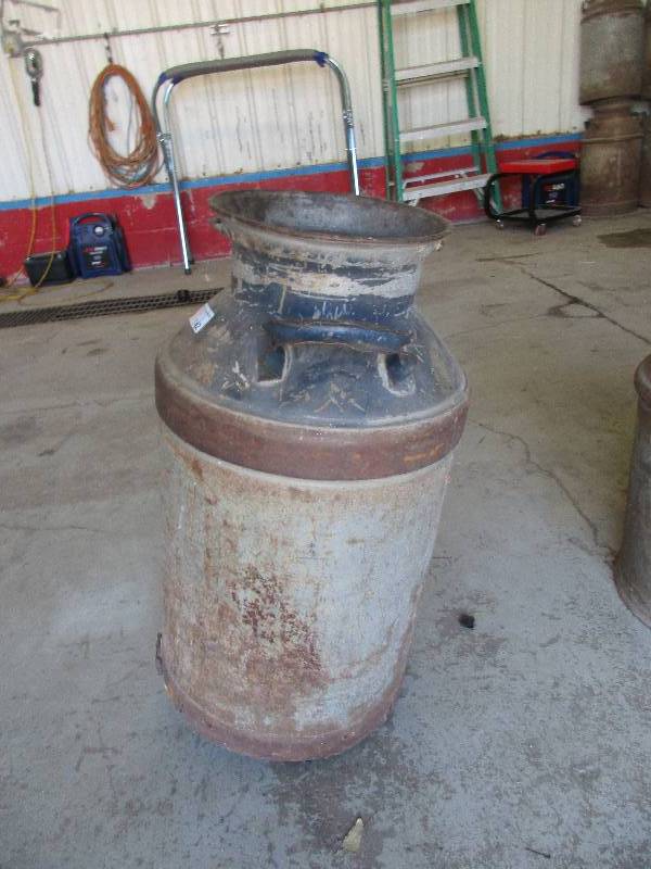 lot 142 image: vintage metal milk jug