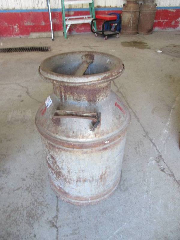 lot 143 image: vintage metal milk jug