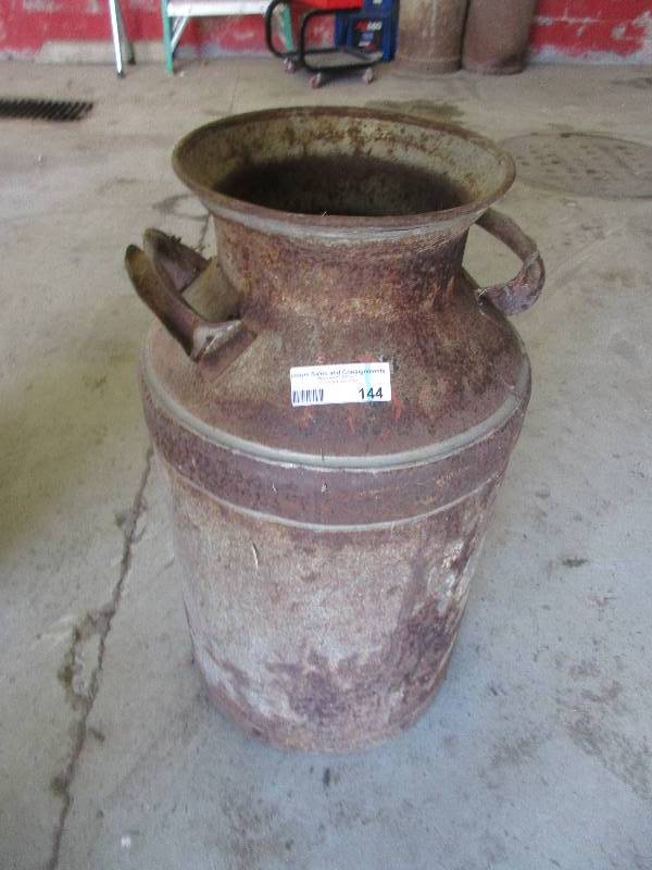 lot 144 image: vintage metal milk jug