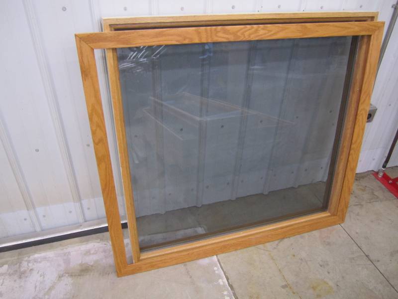 Wood framed double pane window with...