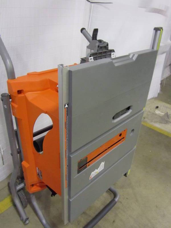 lot 11 image: Ridgid 15 amp 10 heavy duty portable table saw with stand