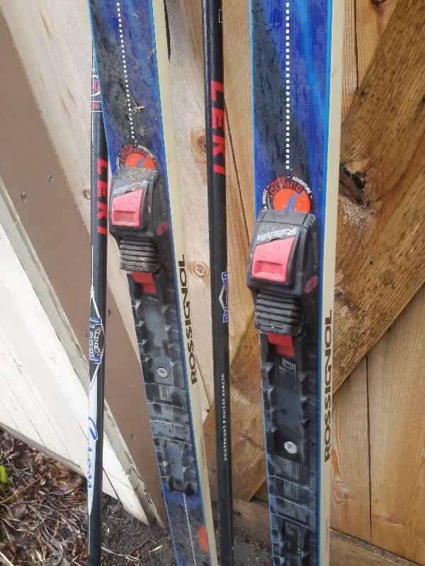 lot 32 image: Pair of Rossignol cross Country skiis and poles