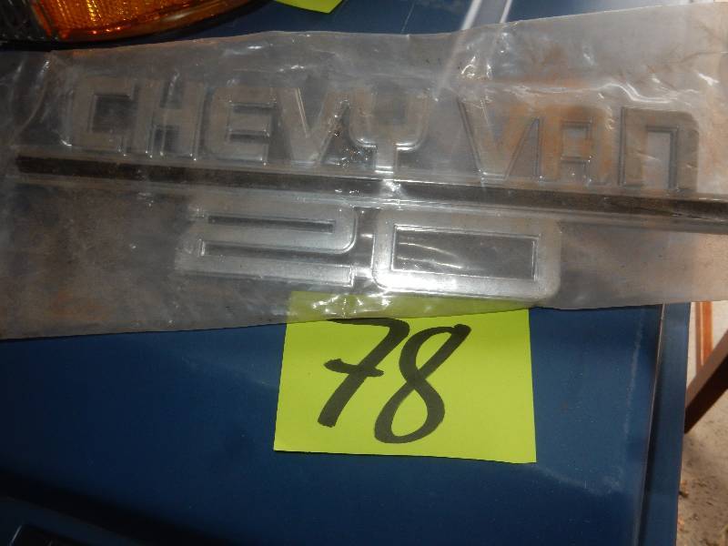 lot 78 image: All metal CHEVYVAN 20 emblem.. New in protective plastic