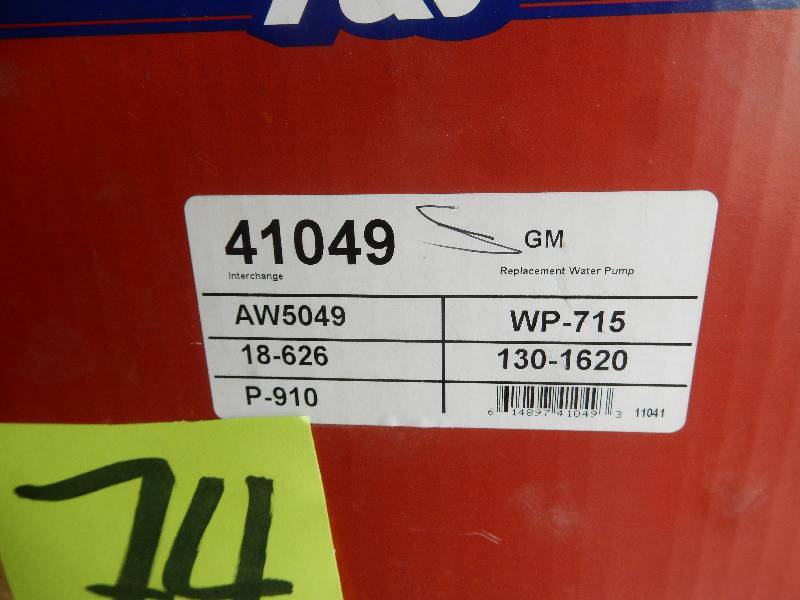lot 74 image: NEW in box water pump..  Tank of some type.