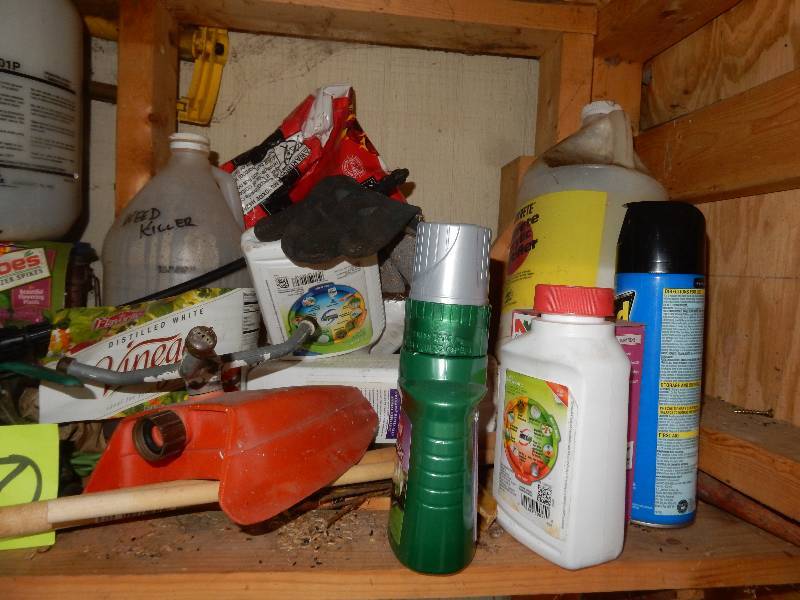 lot 100 image: Everything on the shelf in the gardening cabinet..