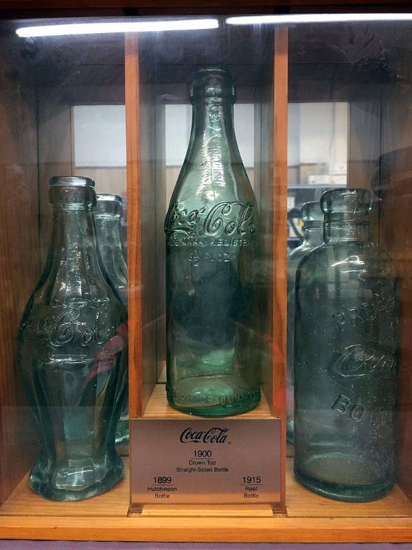 lot 5 image: Wood box with Coke bottles
