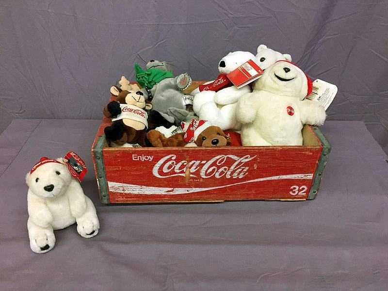 lot 16 image: Coke wood crate full of Coke plush