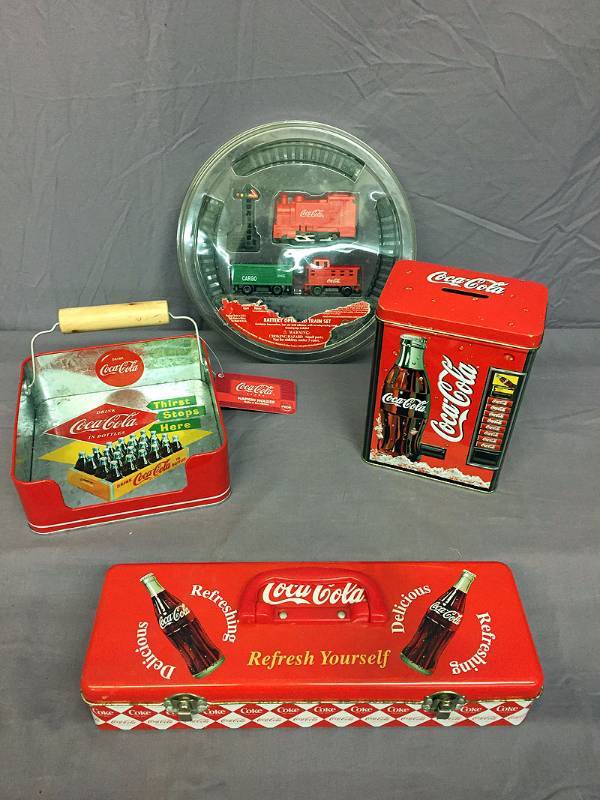 lot 26 image: Coke train and 3 tins