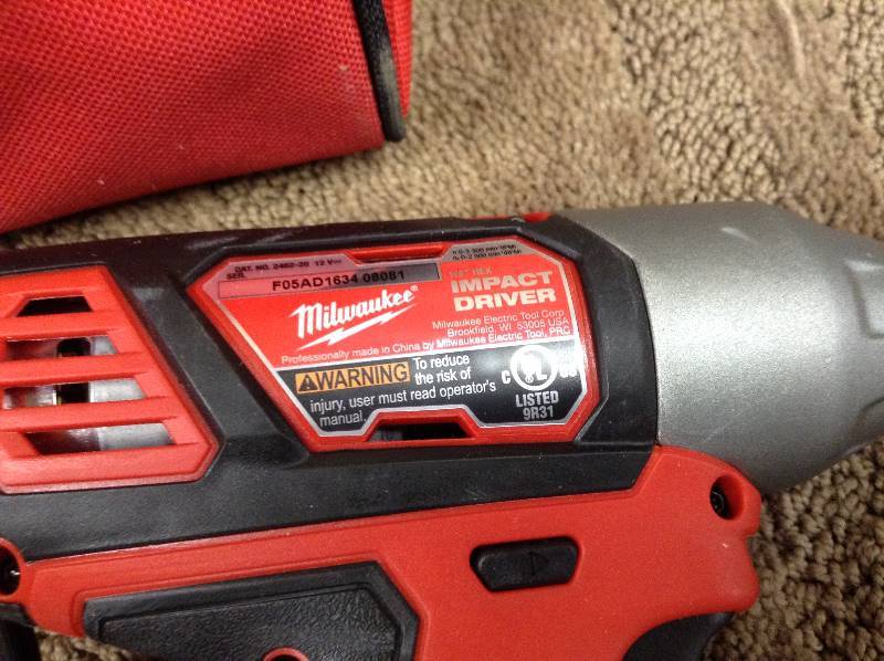 lot 137 image: Milwaukee M12 12-Volt Lithium-Ion Cordless 14 in. Hex Impact (Tool-Only) includes charger
