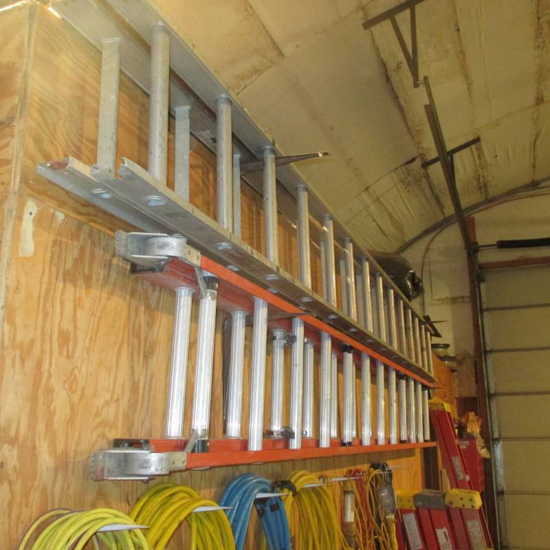 lot 39 image: (2) Extension Ladders 1-Fiberglass 1-Aluminum