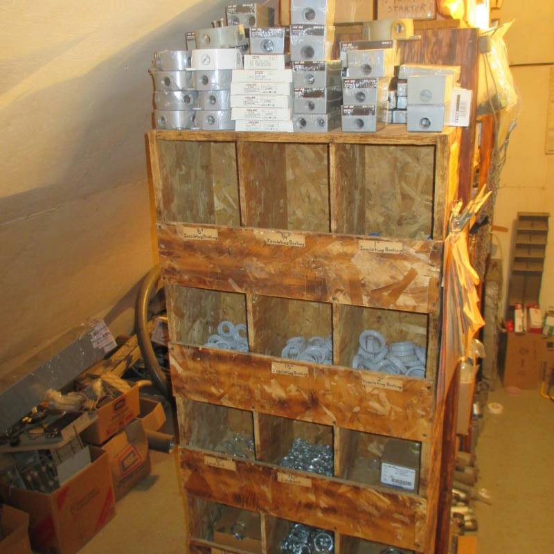 lot 59 image: Contents of Shelf Unit Outdoor Electric Boxes, Conduit Nuts