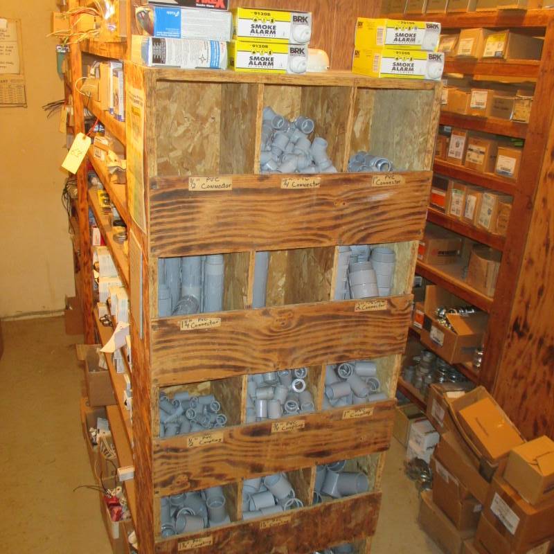 lot 64 image: Contents of Shelf Unit (New) Smoke Alarms & PVC Couplings