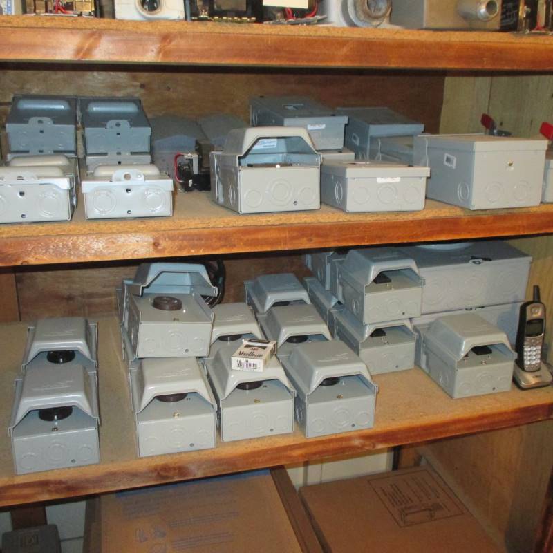 lot 82 image: Contents of 2 Shelves 120v & 220v Outdoor electric boxes (2) Disconnect Switches