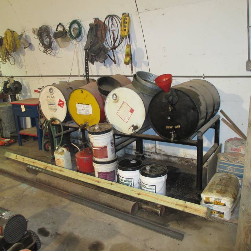 lot 111 image: Oil Barrels wStand on Wheels, Grease Pump, Everything on Wall & Floor