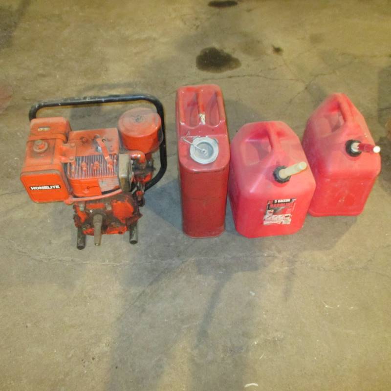 lot 113 image: Briggs & Stratton 8 hp Motor (3) 5 gal Gas Cans