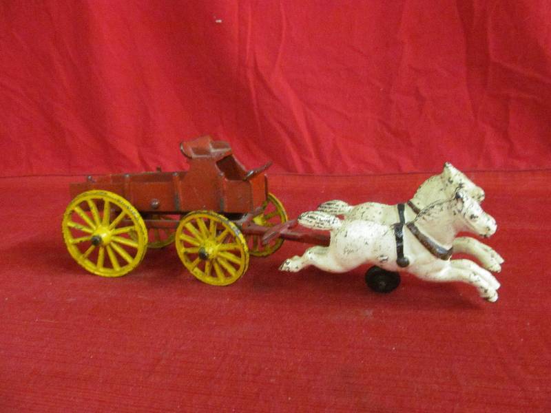 lot 104 image: cast iron horse driver and wagon