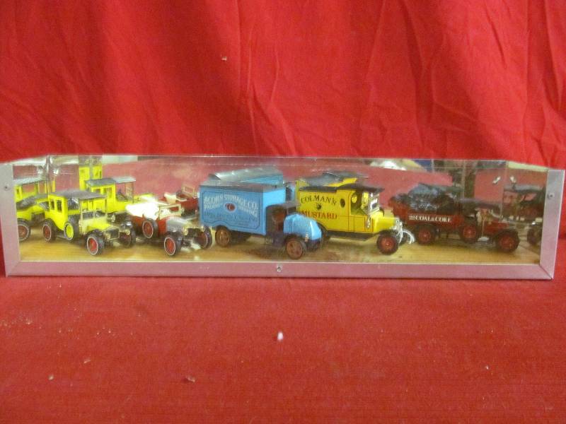 lot 105 image: display case with metal cars