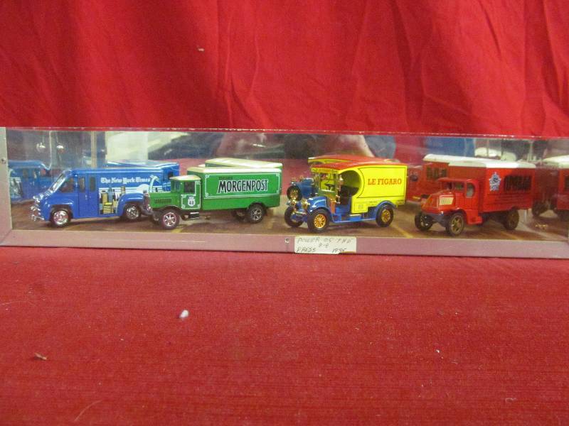 lot 106 image: display case with metal cars