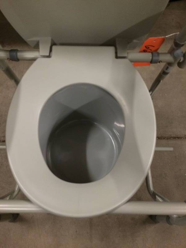lot 17 image: Drive Medical Deluxe Folding Bedside 300Lb Capacity Commode with Bucket and Splash Guard - Excellent Condition