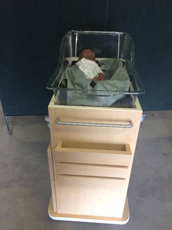 lot 56 image: Retails New $800 Pediatrics Infant Baby Changing 2 Drawer Bassinet Hospital Bed Trolley Cart With Self Closing Drawers Includes Removable Lexon Acryllic Crib - Baby Not Included