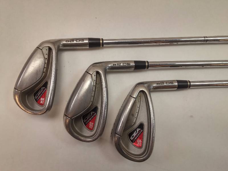 lot 640 image: 12 Clubs Adams 4 Iron, Adams 5 & 6 Irons, Adams 7-9 Irons, Adams 05 Pitching Wedge, Arnold Palmer Charger 54 3 15, Wilson Sand Wedge, Adams 460CC 10 Club, ZX 9.5 S MRH R44 Club, Tour Edge Back Draft B6 Right Hand, Tommy Armour Bag