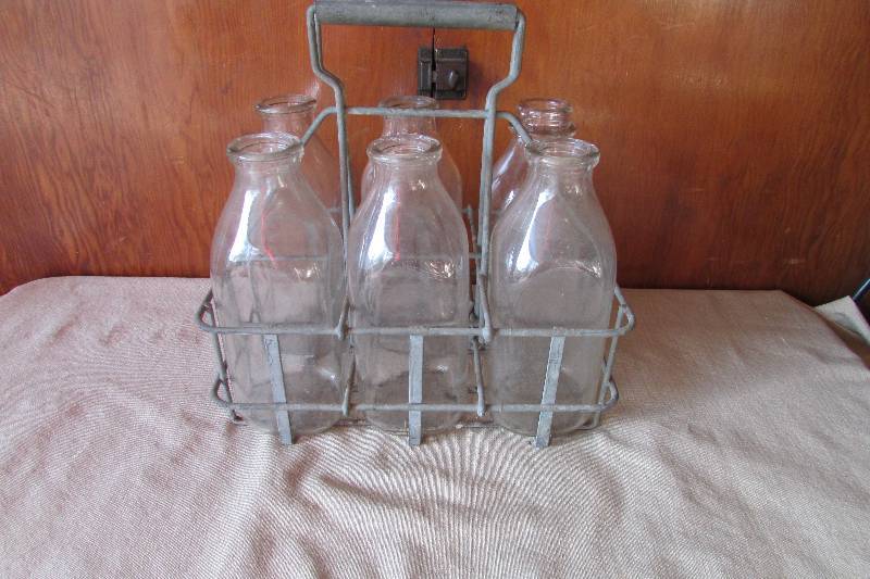 lot 7 image: Vintage Milk Bottles WCarrier