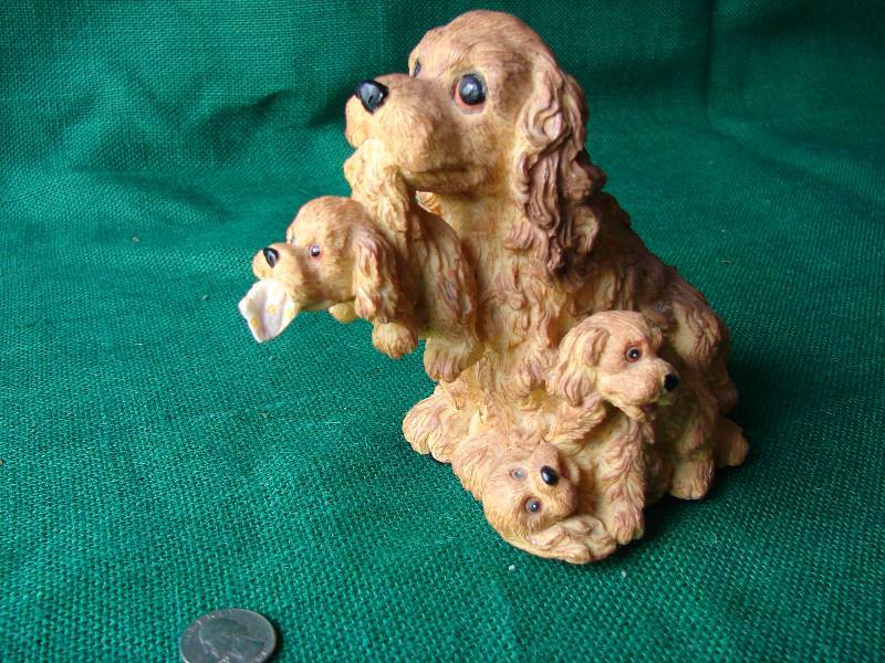 A  MUSIC BOX . A mom and 3 puppies.