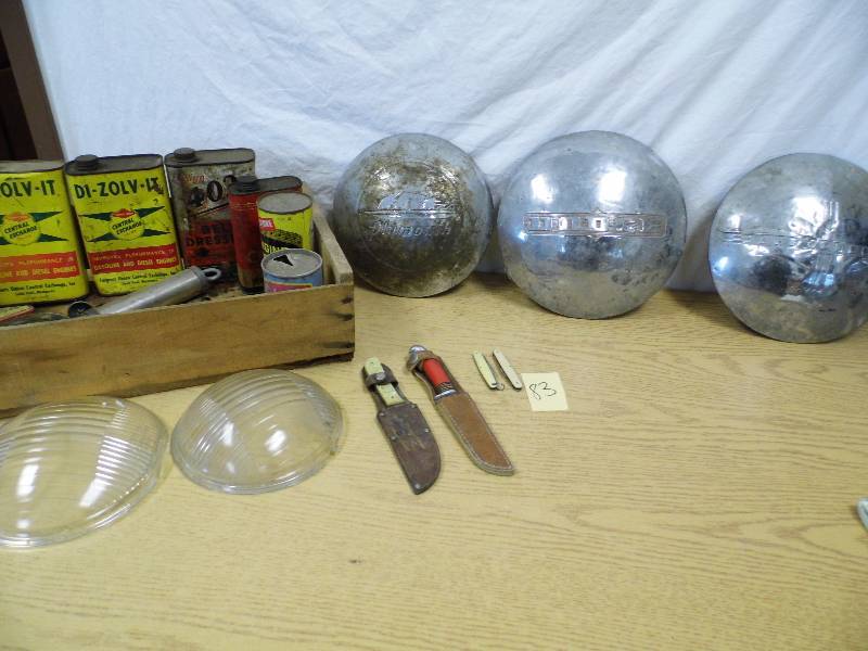 lot 83 image: Vintage Hub Caps - Oil Containers and Crate