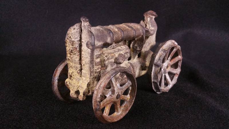 lot 7 image: 1920s 30s Arcade() Cast Iron Ford Tractor w Farmer