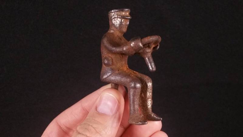 lot 12 image: Cast Iron Bus, Nickel Tractor Driver, Hook Ladder, and AxelsWheels