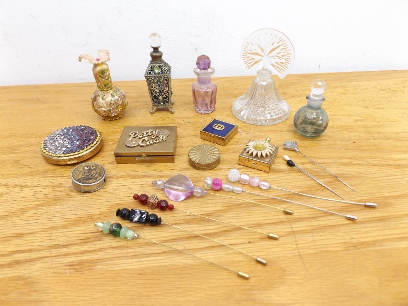 lot 32 image: Lot of Vintage Perfume Bottles, Compacts, and Hair Pins