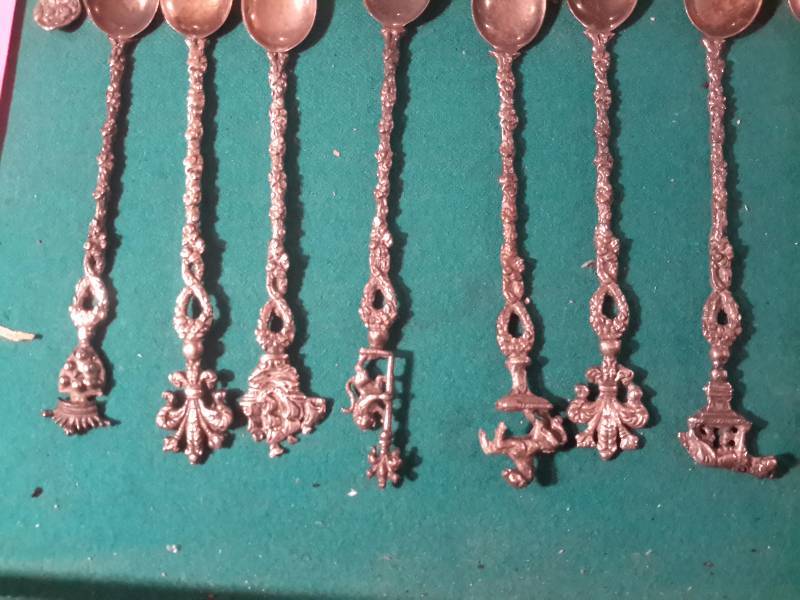 lot 134 image: Lot of small fancy spoons and salt and pepper shakers as shown.
