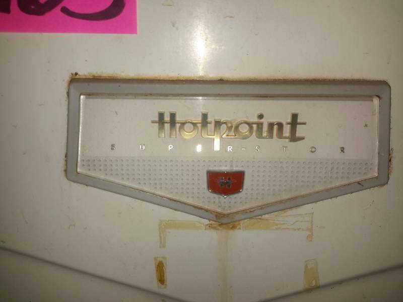 lot 163 image: VINTAGE HOTPOINT refrigerator.. This was working prior to the sale when they emptied it to sell.  This is in the basement. Bring your own loading help to bring up basement stairs