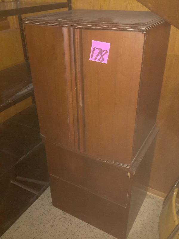 lot 178 image: Metal storage rack, 36 in x 18 in x 60 in h.  Solid wood cabinets as shown.. These are upstairs so bring your own loading help to move down stairs.