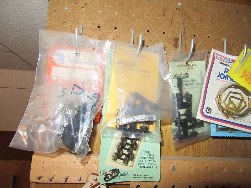 lot 42 image: A Wall of Railroad accessories.. Take the wall board too if you want it.